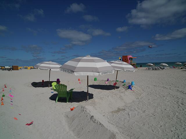 loc-Umbrellas-beach-chairs-and-a-lifeguard-station-on-the-sand-in-the-trendy-Sou.jpg