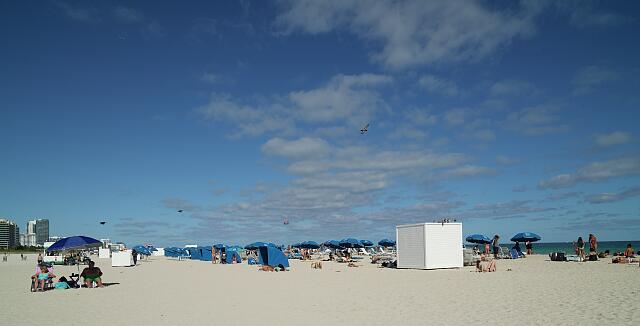 loc-Umbrellas-curved-sun-shelters-and-a-beach-gear-storage-shed-on-the-strand-in.jpg
