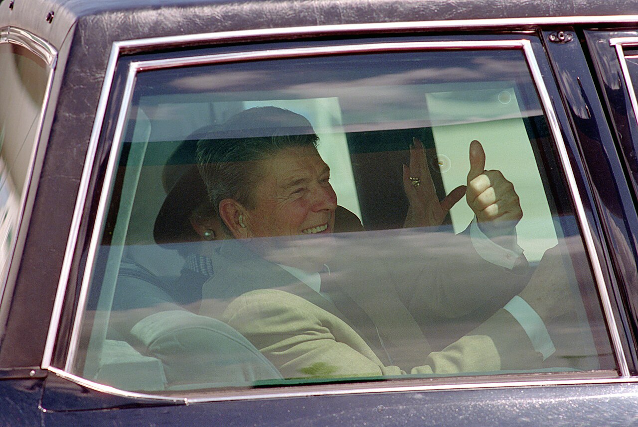 President_Ronald_Reagan_During_a_Trip_to_Miami__Florida_and_His_Departure_Via_Limousine_from_Miami_International_Airport_Giving_The_Thumbs-Up_Sign_-_DPLA_-_8432e2b1186469ad01611ec37036e14e.jpg