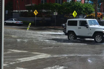 October_17_2016_sunny_day_tidal_flooding_at_Brickell_Bay_Drive_and_12_Street_downtown_Miami__4.36_MLLW_high_tide_am.jpg